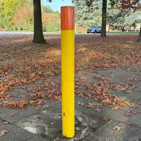 Bollards Dig In yellow commercial premises car park showing ramp Bollard Supplies